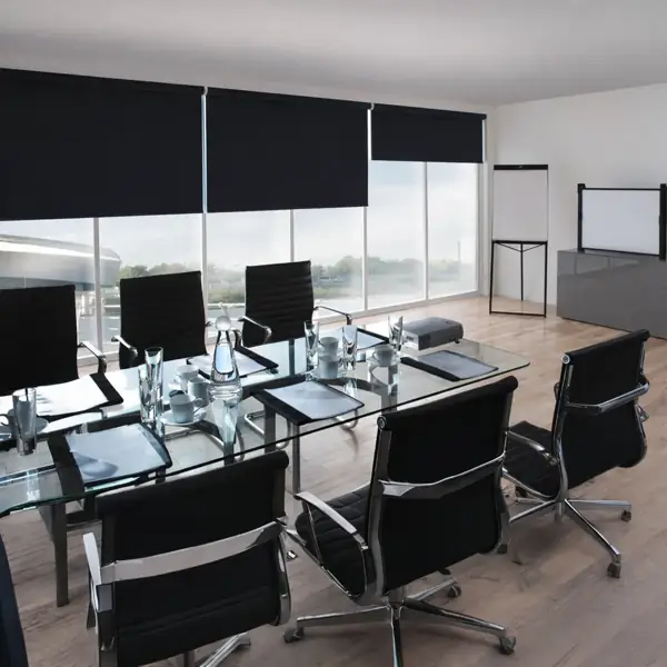Blackout roller blinds in a sleek, modern boardroom.
