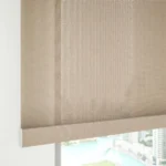 Close-up of beige mesh sunscreen roller blind fabric.