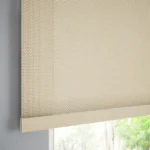 Close-up of dark gray slats and matching headrail.