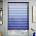 Cobalt blue Venetian blinds on a city view window