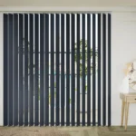 Dark grey vertical blinds covering a large window.