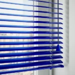 Detail of blue aluminum blinds with pull cord
