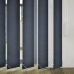 Texture detail of dark fabric vertical blind slats.